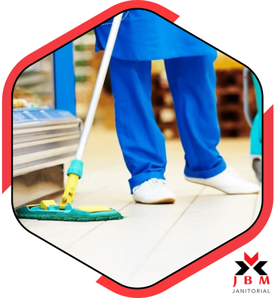 Commercial floor cleaning service mopping floors in a retail store, providing professional floor cleaning solutions for businesses to maintain clean and safe environments.