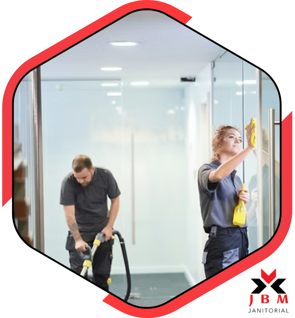 Professional bank cleaning services with staff cleaning glass doors and vacuuming office space, ensuring a clean and secure environment for banking institutions.