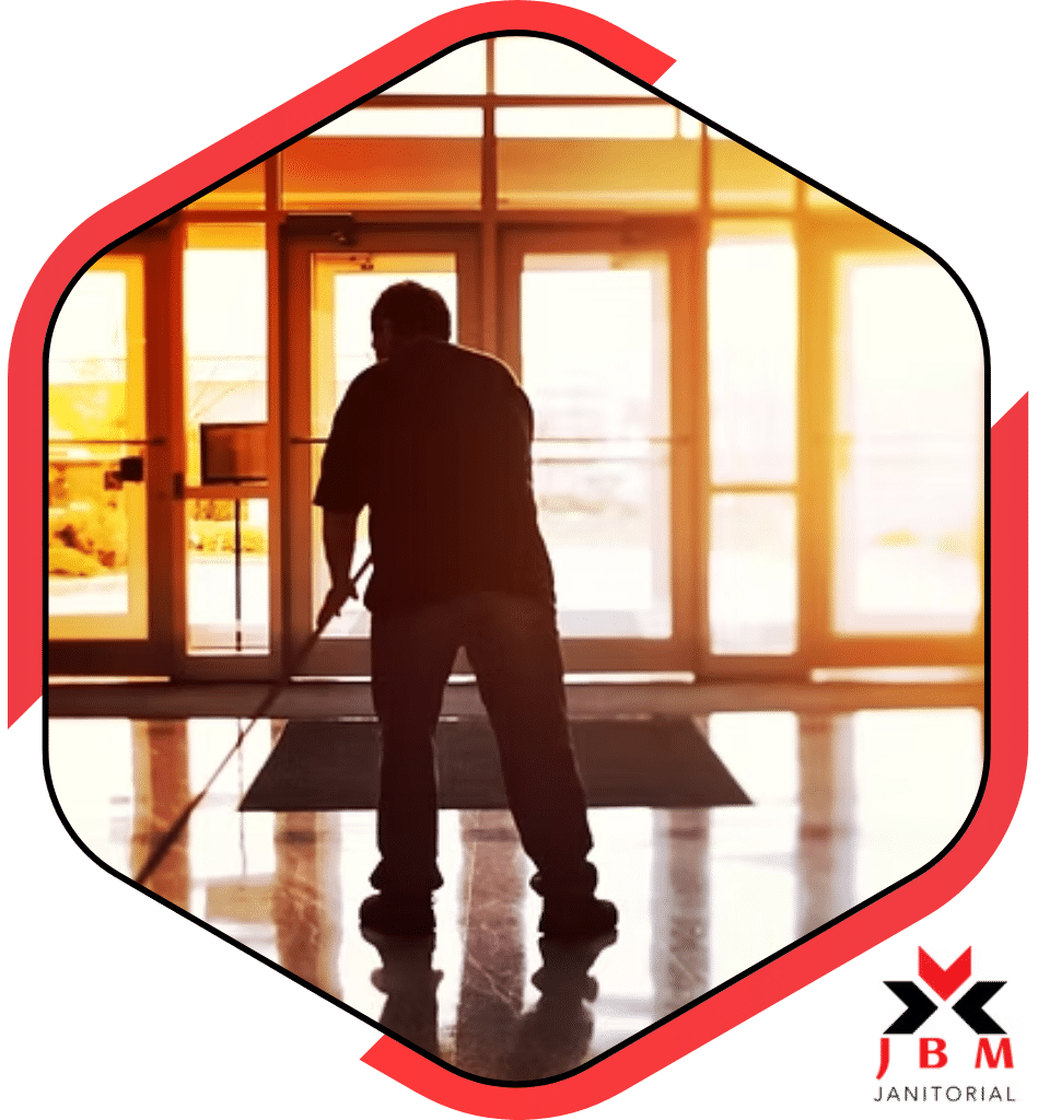 Commercial cleaning services professional mopping the floor in an office lobby, providing cleaning solutions for businesses to maintain a clean and professional environment.