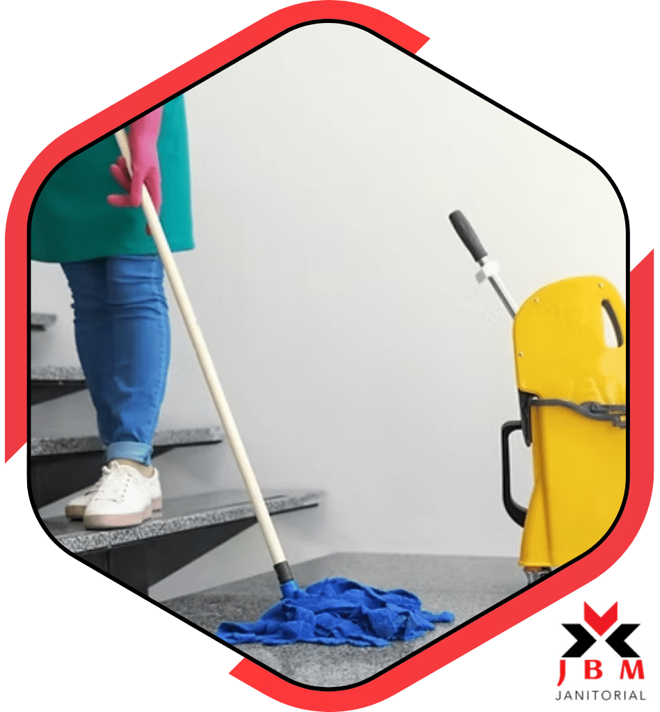 Floor care cleaning services professional mopping stairs with a yellow cleaning cart, providing specialized cleaning solutions for commercial spaces and office buildings.