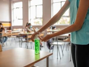 Classroom with hand sanitiser promoting school hygiene to maintain cleanliness and safety for students.