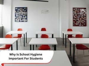 Empty classroom with white desks and red chairs. School hygiene is crucial for a healthy learning environment.